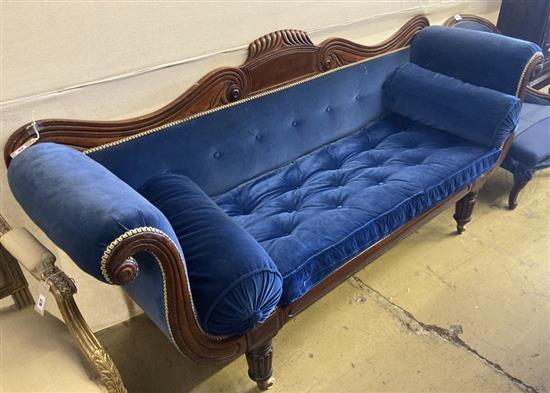 An early Victorian mahogany scroll arm settee upholstered in blue velvet, width 200cm, depth 56cm, height 93cm